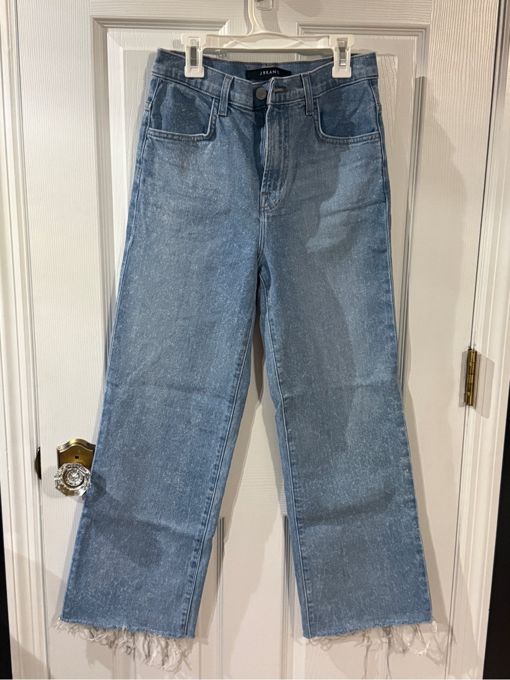 J Brand High-Rise Wide Leg Jeans in Light Blue designed with splatter on them